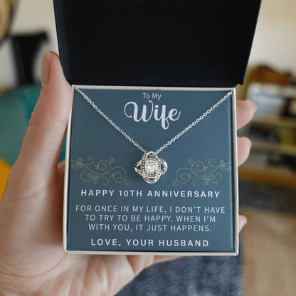 elegant love knot necklace presented in a gift box for a tenth anniversary celebration