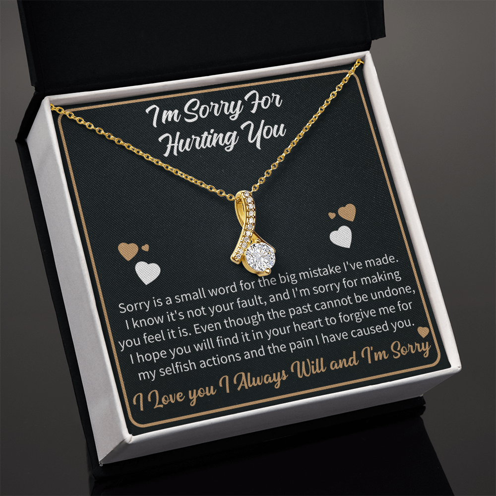 apology necklace displayed with a heartfelt message card expressing forgiveness