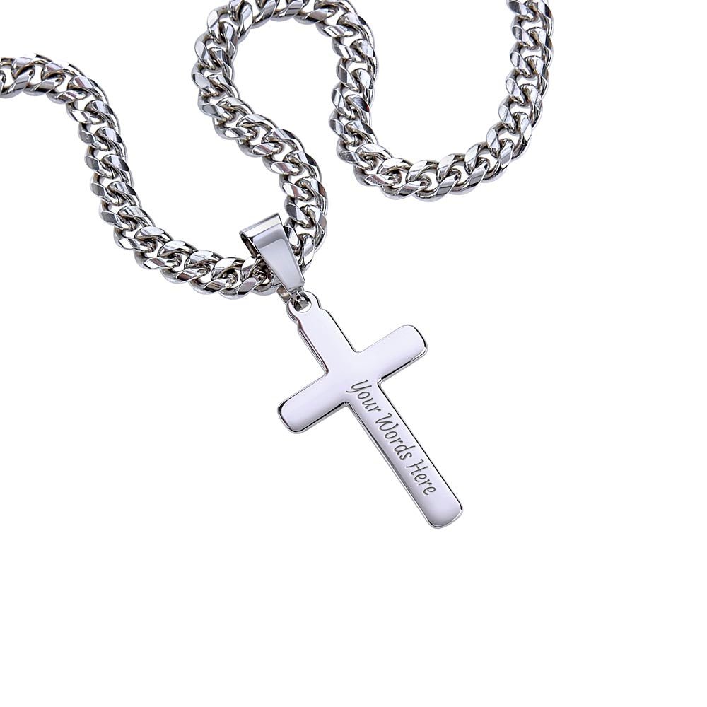 close up of engraved artisan cross pendant on a bold cuban link chain
