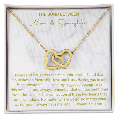 close up of a charm necklace celebrating the special connection of mother and daughter